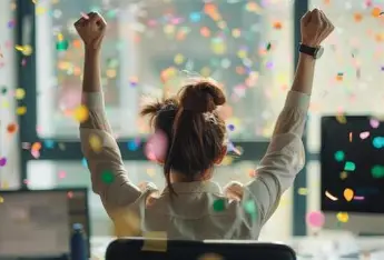 Content creator celebrating success with confetti after growing with Klap AI video editor